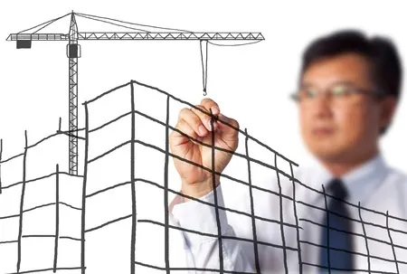 Esquisse d’un bâtiment en construction et d’une grue tracée au feutre